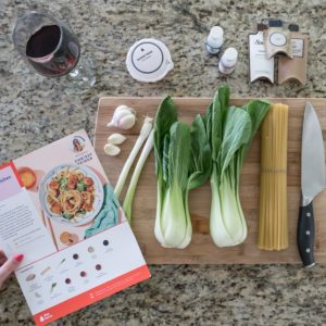 Fresh ingredients on a cutting board for a Chrissy Teigan Recipe from Blue Apron.