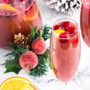 red pomegranate mimosa in christmas scene on white marble